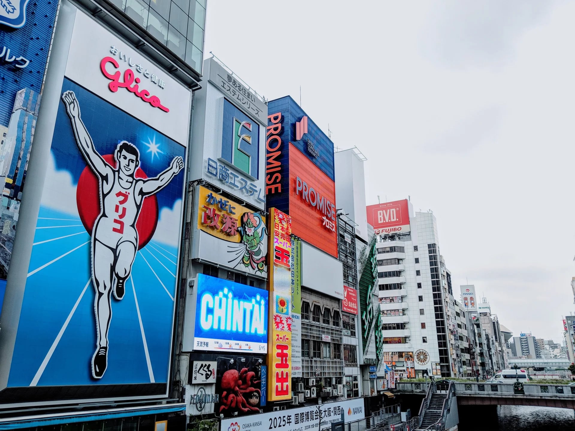 Vibrant advertisements in Dotonbori district with the famous Glico Man sign